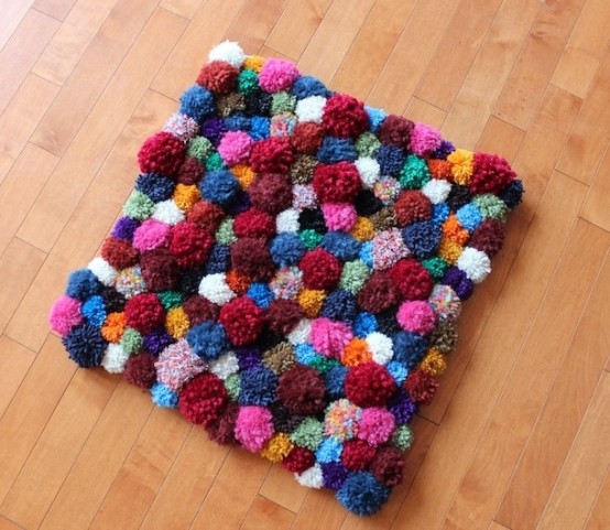 a colorful pompom mat can be a nice idea not only for a bathroom but also for any other space, add more color to the interior