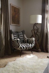 a stylish mid-century modern chair with zebra upholstery and tall legs will make a statement both with its print and design