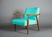 a bright mid-century modern chair with staind armrests and legs and bold turquoise upholstery is a cool idea with much color to add to your living room