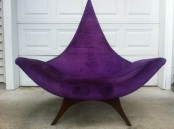 a bold and catchy purple mid-century modern chair with a pointed back and tall legs, with armrests is a stylish idea for adding color and a sharp touch with its design