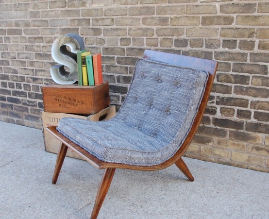 a creative grey mid-century modern chair with a stained frame and grey upholstery is a stylish idea for a cozy modern space