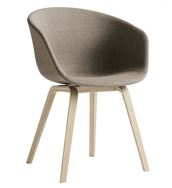 a grey mid-century modern chair with a comfortable frame and legs and a seat on top is a classic design for a modern space