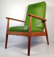 a green leather chair with a stained frame is a lovely idea for a mid-century modern space or a cozy modern living room