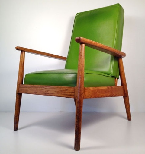 a green leather chair with a stained frame is a lovely idea for a mid century modern space or a cozy modern living room