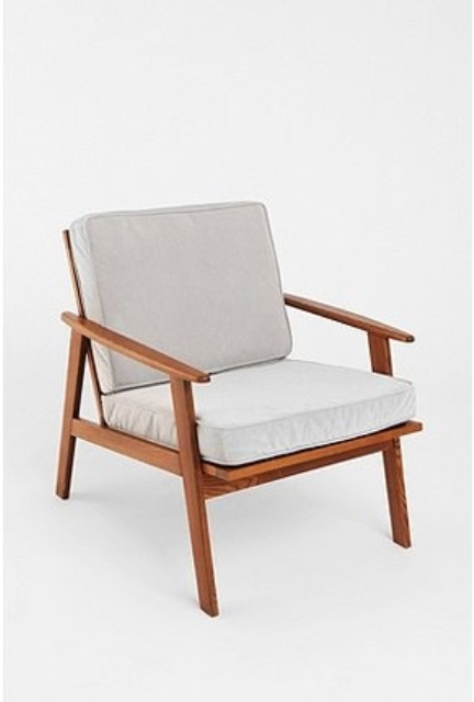 a classic mid-century modern chair with stained frames and legs and neutral upholstery is a cool solution that can match many spaces