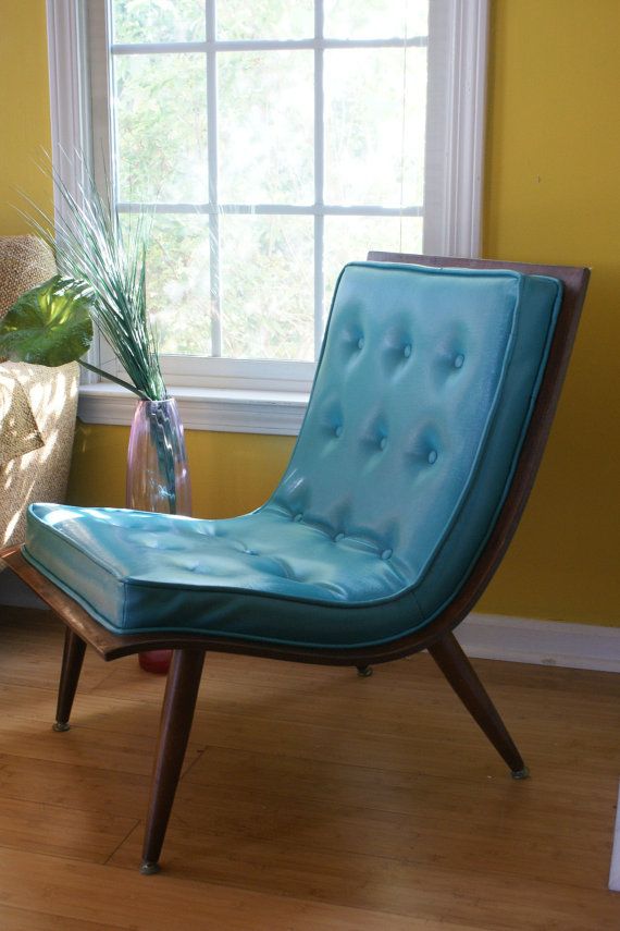a cool mid century modern chair with a stained base and legs plus blue diamond upholstery on top is a very catchy and cool idea