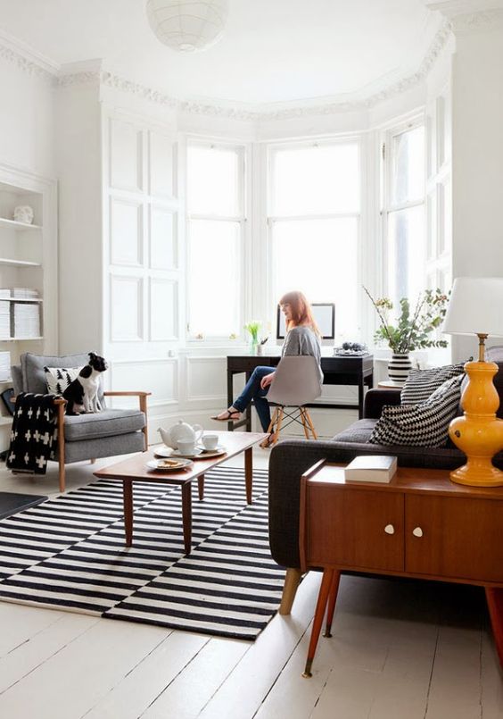 mid-century living room with monochrome rug