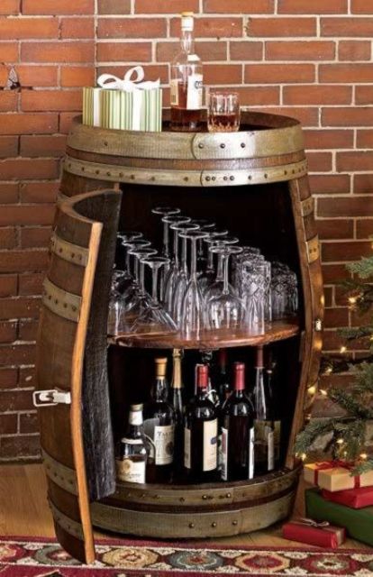 a mini home bar styled as a barrel of dark stained wood and metal is a quirky idea or decoration