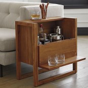 a wooden side table that doubles as a home bar is a cool piece that won’t take much space and will give you enough space for drinks