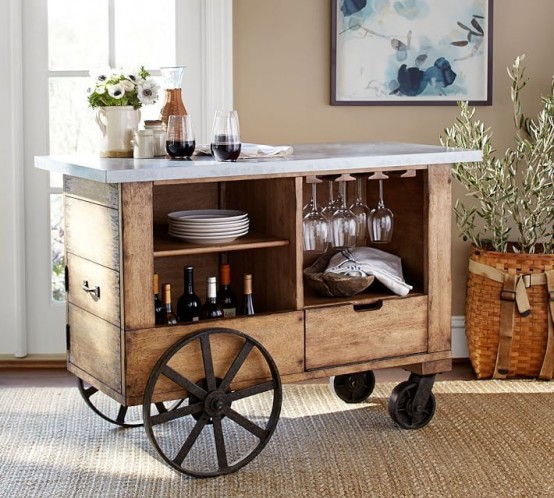 a vintage rustic bar cart of crate wood, with large wheels and a marble countertop plus white blooms