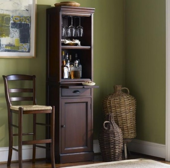 an elegant and vintage dark stained home bar with open and closed storage compartments