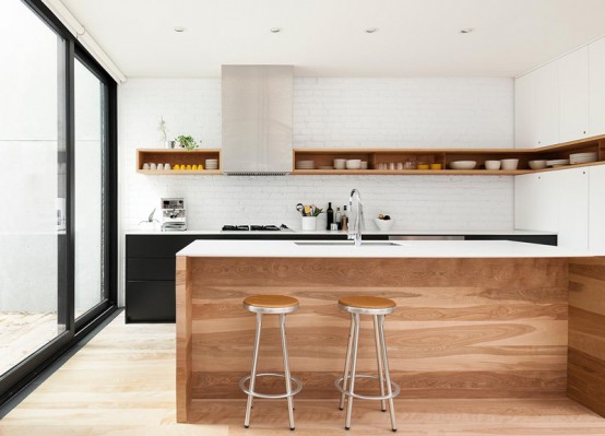 Minimal Black And White Kitchen With A White Brick Wall