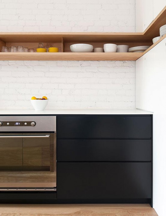 Minimal Black And White Kitchen With A White Brick Wall