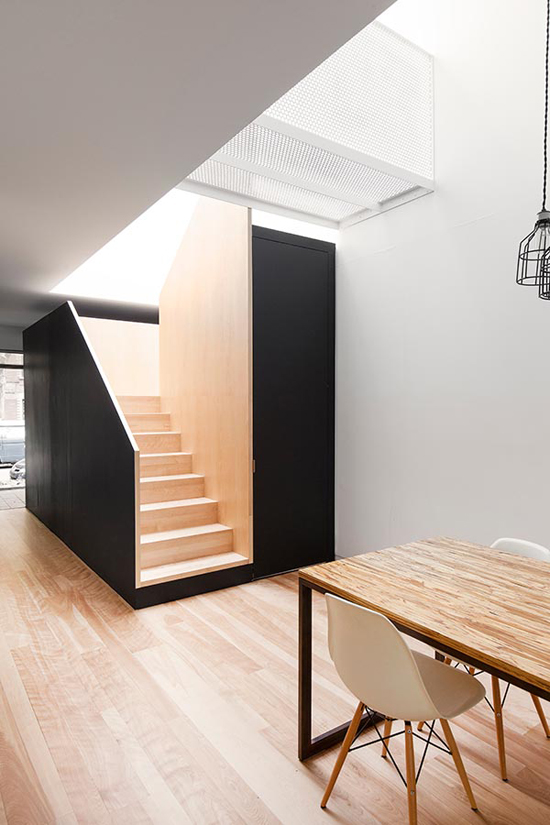 Minimal Black And White Kitchen With A White Brick Wall