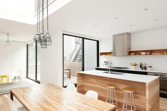 Minimal Black And White Kitchen With A White Brick Wall