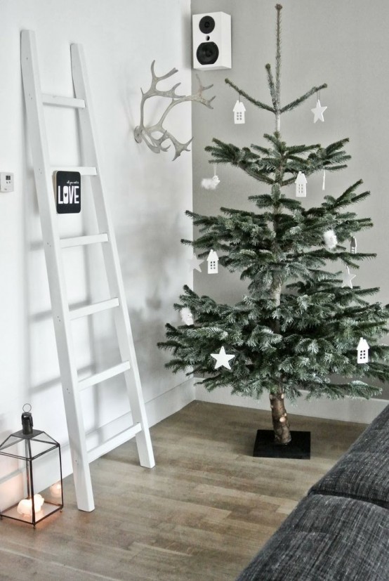 a minimalist Christmas tree with some simple white clay Christmas ornaments is a gorgeous solution for these holidays