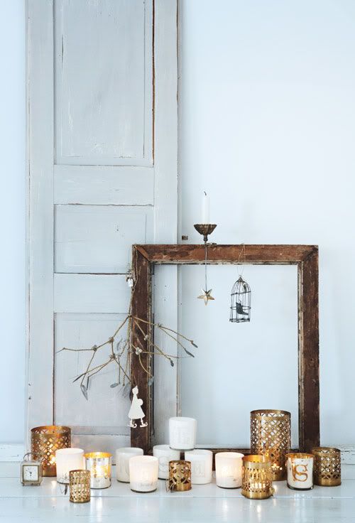 candles in laser cut metal candleholders, a frame with a cage and suspended candleholders