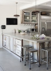 an eclectic kitchen with shabby chic neutral cabinets done with concrete countertops, with shabby chic stools and shabby chic and modern lamps