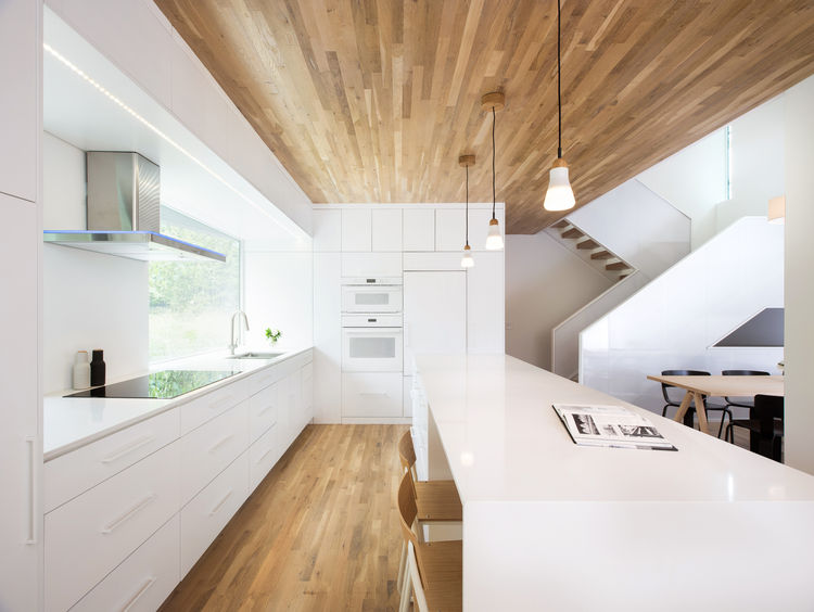 Minimalist Home With Oak Surfaced Interior On A Tricky Site