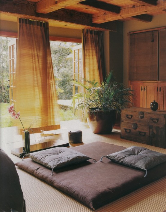 a contemproary Asian-inspired meditation space with curtains, mattresses and pillows