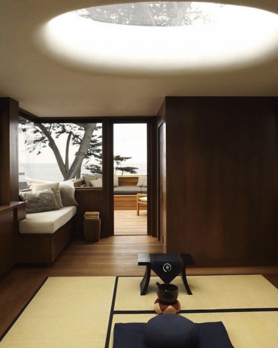 a minimalist Japanese meditation room with rugs and low furniture plus ottomans and pillows