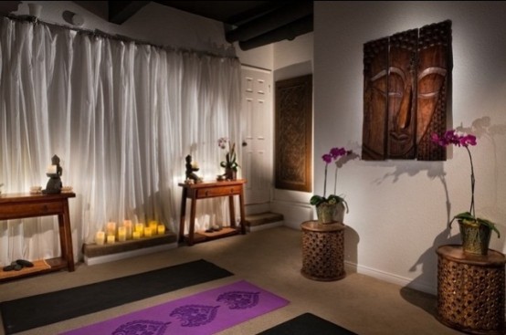 a colorful Asian-inspired meditation room with candles, potted blooms, artworks and much more