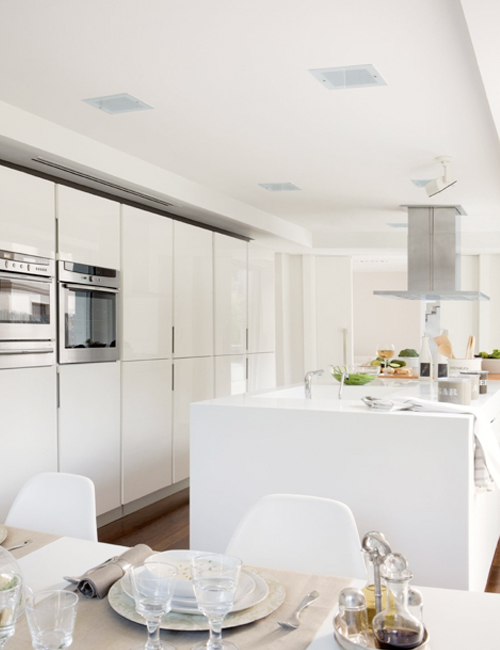 Minimalist White Kitchen With A Summer Feel