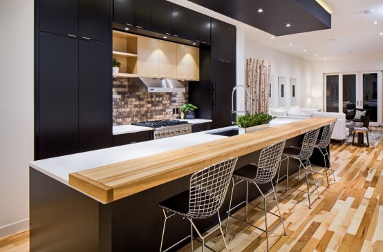 a good-looking black kitchen with an island