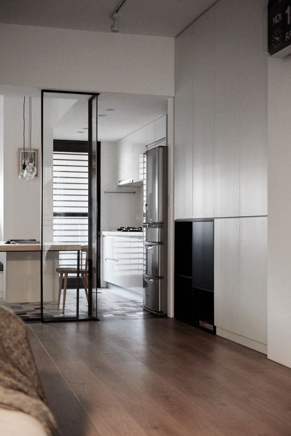 Modern Apartment With Glass Doors That Enlarge The Space To declutter the rooms, the designers added enough storage cabinets, and this solution helps to visually enlarge the rooms