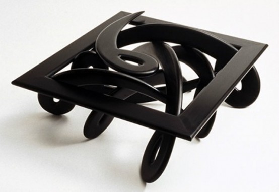 a black swirl coffee table will add a whimsy touch to the space and will make it look quirky and bold