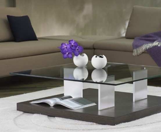 a creative modern coffee table with two tabletops - a plywood and a glass one plus clear legs