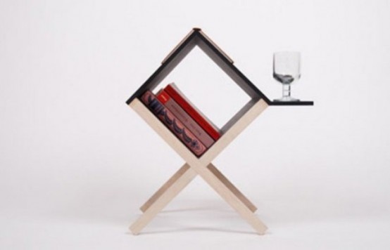 a tiny coffee or side table shaped as a cube, with books inside, a stand for a glass or mug outside