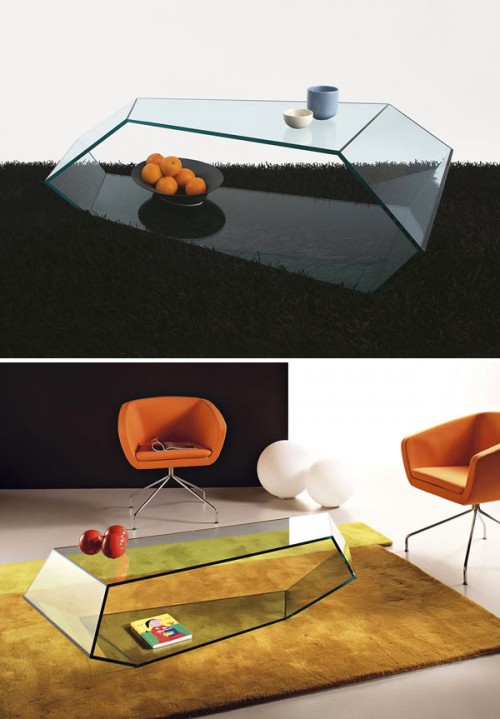 a whimsical glass coffee table of an irregular shape with a storage space is a catchy and cool solution for many rooms