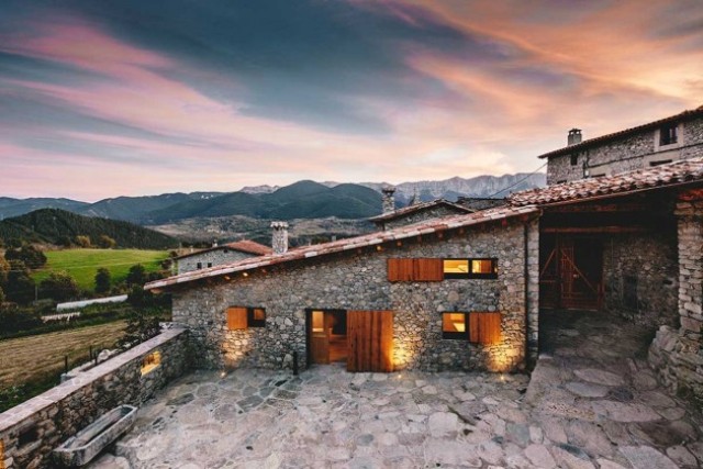 Modern Home With Stone Walls And Wooden Beams