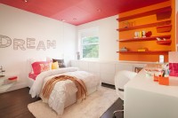 a white teen girl bedroom with a red ceiling and an orange and red accent wall, with sleek minimalist furniture