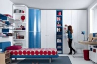 a colorful teen girl bedroom in white with pink and blue touches and printed bedding is a cool idea