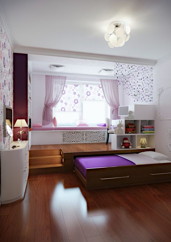 a modern romantic girl's bedroom with a windowsill daybed, a retracted bed, storage units and touches of pink and purple