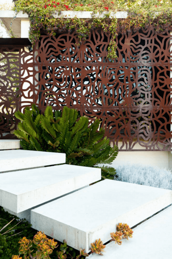 patterned iron screens will make your space private and stylish and will add pattern to outdoors and indoors