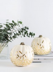white pumpkins decorated with gold confetti is a cool and easy modern idea to rock for Thanksgiving
