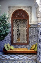 a fantastic riad clad with gorgeous Moroccan tiles, different on the walls, floor and over the window looks jaw-dropping