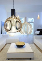 oversized wood slat lampshades over the space will make it stand out a lot, they add a modern feel to the space