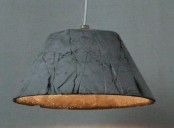 a concrete lampshade is a creative idea for an industrial, modern or wabi-sabi space, it looks veyr unusual and makes a statement