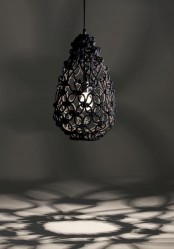a black woven pendant lamp shaped as an egg is a cool and catchy idea that will match an industrial or boho space