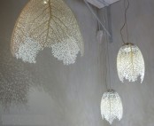 white pendant lamps with lampshades of leaves will bring a botanical touch to the space and will make it ultimate