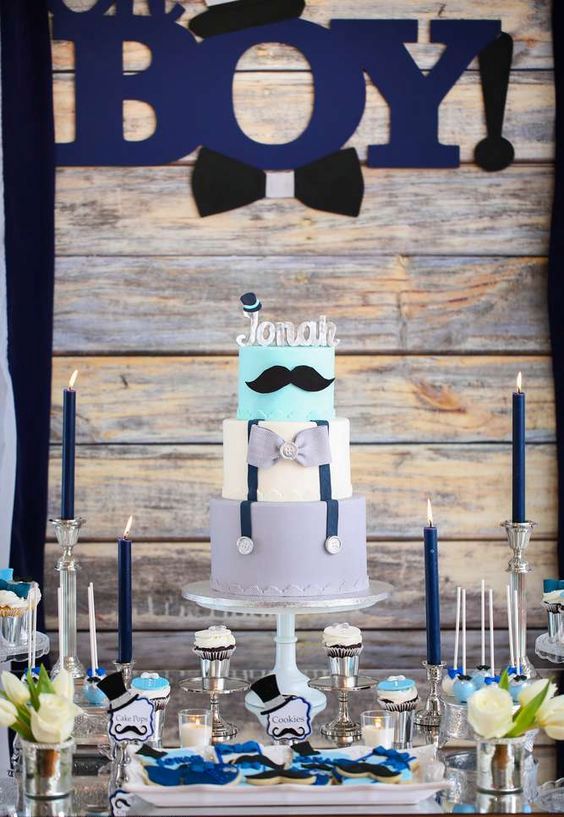 moustache-themed dessert table for a boy baby shower