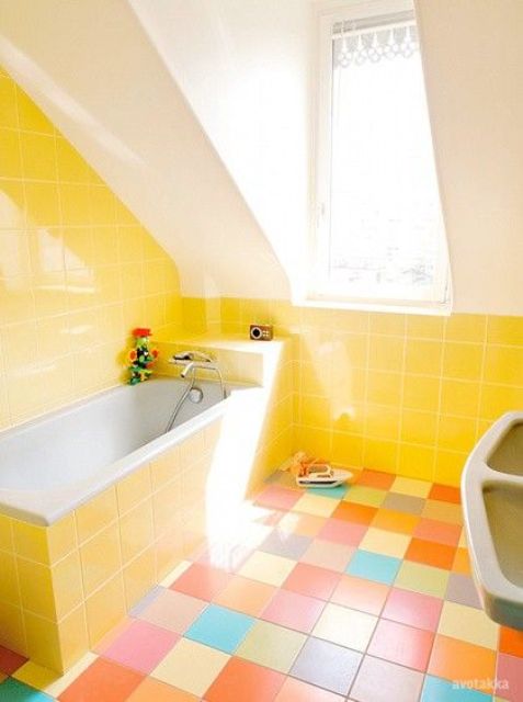 a yellow and white bathroom with a colorful tile floor is a fun idea to raise your mood and is a creative and bold space