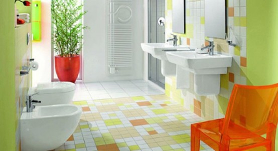 a neon yellow bathroom with a bold tile floor, wiht orange accents feels like spring or summer and is very inviting