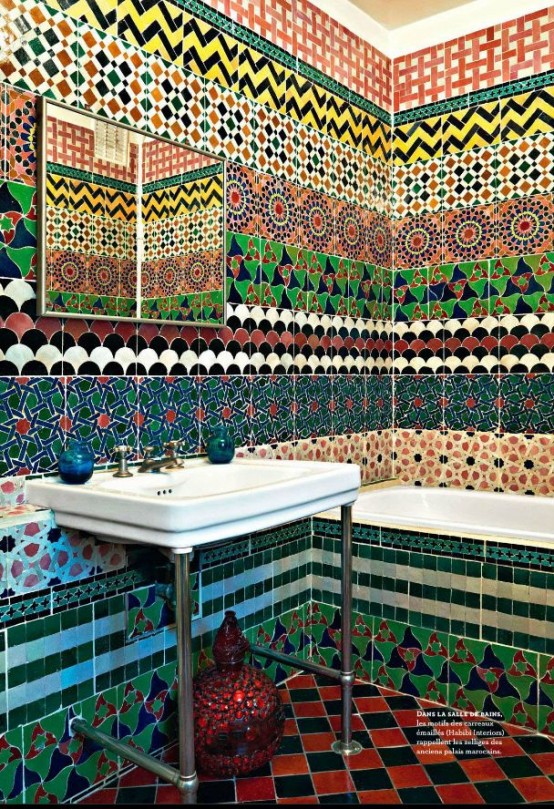 an Eastern bathroom clad with colorful printed tiles all over looks incredible, this is a real Eastern oasis, just add vintage Moroccan lanterns