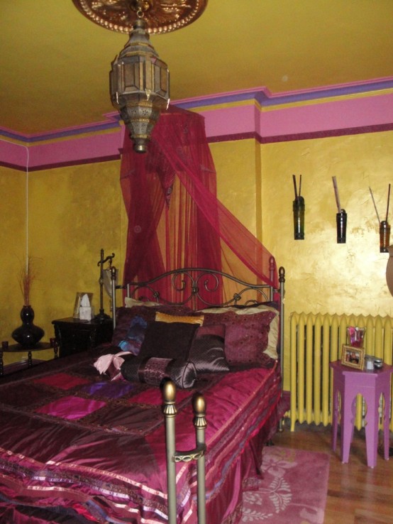 gold, pink, hot red and burgundy and Moroccan lanterns create a genuine Eastern sleeping space