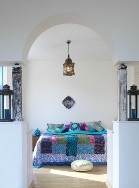 a Moroccan lantern, bright textiles and Moroccan pillows and cushions for a modern take on traditional Eastern bedrooms